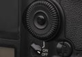 Close-up macro shot of a modern digital SLR camera. Detailed photo of black camera body with a classic wide aperture portrait lens Royalty Free Stock Photo