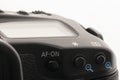 Close-up macro shot of a modern digital SLR camera. Detailed photo of black camera body with a classic wide aperture portrait lens Royalty Free Stock Photo