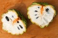 Close up macro shot of an opened up Sugar apple. Fruta de Conde Earl Fruit on a wooden surface with clearly visible Royalty Free Stock Photo