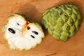 Close up macro shot of an opened up Sugar apple. Fruta de Conde Earl Fruit on a wooden surface with clearly visible Royalty Free Stock Photo