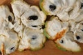 Close up macro shot of an opened up Sugar apple. Fruta de Conde Earl Fruit on a wooden surface with clearly visible Royalty Free Stock Photo