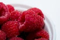 Close up / macro shot of raspberries in a white bowl Royalty Free Stock Photo