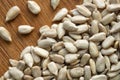 Close up macro shot of shelled sunflower seeds on a wooden background. Top view Royalty Free Stock Photo