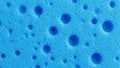 Close-up Macro View of a Bright Blue Sponge with Numerous Small and Large Bubbles Royalty Free Stock Photo