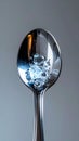 Effervescent Water Bubbling in a Metal Spoon Royalty Free Stock Photo