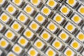 Close-up macro view of led smd bulb lamp with rows of yellow diode light components panel. Tech abstract texture pattern Royalty Free Stock Photo