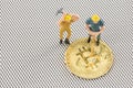 Close up macro view of miners figurine on bitcoin