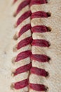 Close up macro view of red stitched seams of an worn baseball Royalty Free Stock Photo