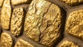 Close-up macro view of rough gold nuggets embedded in textured wall Royalty Free Stock Photo
