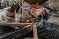 Close up macro of welding in workshop, male welder using electrode Royalty Free Stock Photo