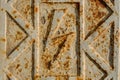 Close up macrophotography of white rusty door with a lightning sign