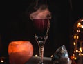 Close-up of magic potion in a glass. Magic and wizardry concept