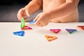 Close up of magnetic building toy. Child playing with development toy.