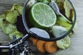 Close-up through a magnifying glass on limes and vegetables