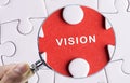 Close up Magnifying glass searching missing puzzle peace Vision Royalty Free Stock Photo