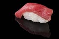 Close-up of Maguro sushi with tuna on a black background