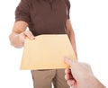 Close-up of mailman delivering mail to person