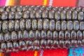 Close up of Maiz Morado, Purple Corn, Zea mays indurata, k\'culli or Black Aztec Corn on a traditional colourful peruvian