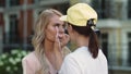 Closeup make up artist doing make up. Actress preparing for filming outdoor Royalty Free Stock Photo