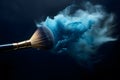 Close up of makeup brush with blue powder