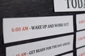 Close up making agenda Daily schedule on personal organizer. Business and entrepreneur concept. Isolated on black background Royalty Free Stock Photo