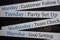 Close up making agenda weekly schedule on personal organizer. Business and entrepreneur concept. Isolated on blackboard