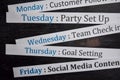 Close up making agenda weekly schedule on personal organizer. Business and entrepreneur concept. Isolated on blackboard