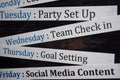 Close up making agenda weekly schedule on personal organizer. Business and entrepreneur concept. Isolated on blackboard Royalty Free Stock Photo