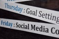 Close up making agenda weekly schedule on personal organizer. Business and entrepreneur concept. Isolated on blackboard Royalty Free Stock Photo