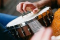 Close up of a Male Banjo player relaxing on the porch, practicing and picking away Royalty Free Stock Photo