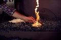 Close Up Of Male Blacksmith Lighting Wood Kindling To Start Blaze In Forge