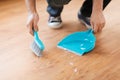 Close up of male brooming wooden floor Royalty Free Stock Photo