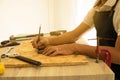 Close-up of male carpenter hands drawing mark on wooden flooring Royalty Free Stock Photo