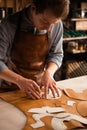 Close up of a male cobbler working with leather textile