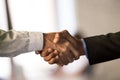 Close up of male employees handshake closing deal Royalty Free Stock Photo