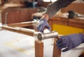 Close Up Of Male Craftsman In Workshop Assembling Hand Built Sustainable Bamboo Bicycle Frame