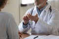 Close up of male doctor consult patient at meeting