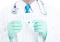 Close-up of male doctor holding blister of suppositories