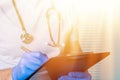 close up of male doctor holding prescription paper in hand