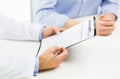 Close up of male doctor and patient with clipboard Royalty Free Stock Photo