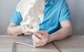 Close up of male doctor& x27;s hand showing ischial tuberosity or sit bones on pelvic girdle model, pelvic pain sydrome Royalty Free Stock Photo