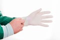 Close-up of male doctor`s hands putting on sterilized surgical glove