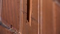 Close up of male with electric drill perforator before making a hole in red brick wall. Stock footage. Worker and Royalty Free Stock Photo