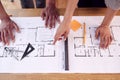 Close Up Male And Female Architects Working In Office Looking At Plans For New Building On Desk Royalty Free Stock Photo