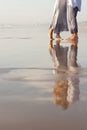 Close-up of male and female bare feet on sunny day Royalty Free Stock Photo