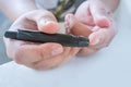 Close up of male finger patient pricking his finger to draw a d