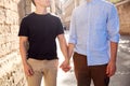 Close Up Of Male Gay Couple On Vacation Holding Hands Walking Along City Street Royalty Free Stock Photo