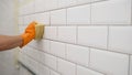 Close-up of male gloved hands using an environmentally friendly sponge and natural spray on the tile surface. Ceramic Royalty Free Stock Photo