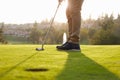 Close Up Of Male Golfer Lining Up Putt On Green Royalty Free Stock Photo