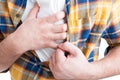 Close-up of male hand on chest durring infarct